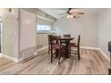 Cozy dining area featuring a ceiling fan and hardwood floors next to an open kitchen space at 2080 Karen Ave # 34, Las Vegas, NV 89169