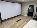 Bright living room featuring a projection screen and sleek, modern fireplace at 2080 Karen Ave # 34, Las Vegas, NV 89169