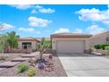 Welcoming single-story home with mature desert landscaping and a spacious two-car garage at 2232 Beacon Ridge Dr, Las Vegas, NV 89134