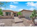 Charming home featuring desert landscaping, brick walkway, and inviting front entrance at 2232 Beacon Ridge Dr, Las Vegas, NV 89134