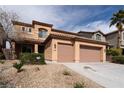 Charming two-story home with a two-car garage and low-maintenance landscaping at 2532 Bechamel Pl, Henderson, NV 89044