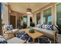 Outdoor patio with comfortable seating, stylish rug and overhead lighting perfect for relaxing at 2555 Hampton Rd # 10104, Henderson, NV 89052