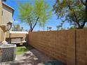 Backyard featuring a small green space, a patio, and a swing with seating at 4256 Perfect Drift St, Las Vegas, NV 89129