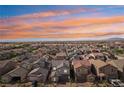 A captivating aerial view of a neighborhood with homes featuring diverse roof styles at 4347 Outlook Vista Ave, North Las Vegas, NV 89084