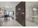 Bright condo featuring tile floors, modern lighting, and convenient access to the bathroom and bedroom at 4381 W Flamingo Rd # 27308, Las Vegas, NV 89103