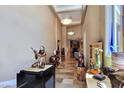 Elegant foyer with high ceilings, marble floors, decorative lighting, and unique art pieces at 5416 Alabaster Ct, Las Vegas, NV 89149