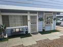 Charming exterior showcasing a well-maintained facade with outdoor seating and landscaping at 5419 Centurion Ct # 102, Las Vegas, NV 89122