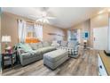 Cozy living room featuring comfortable seating, vaulted ceilings, and natural light at 5532 Sentinel Bridge St, Las Vegas, NV 89130