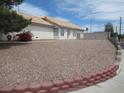Well-maintained single-story home with a tile roof and low-maintenance gravel front yard at 600 Sarajane Ln, Las Vegas, NV 89107