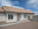 Inviting front entrance with security door and well-maintained gravel landscaping at 600 Sarajane Ln, Las Vegas, NV 89107