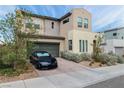 Attractive two-story home featuring neutral stucco, an arched entry, desert landscaping, and a two-car garage at 6142 W Levi Ave, Las Vegas, NV 89141