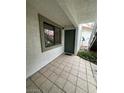 A tiled entryway with a dark-green door and a window showcases a clean and inviting entrance at 6749 W Charleston Blvd # 2, Las Vegas, NV 89146
