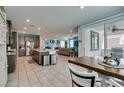 Spacious open floorplan combines kitchen, dining area, and living room for seamless entertaining at 7821 Mazarine St, North Las Vegas, NV 89084