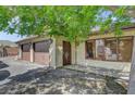 Three-car garage with abundant parking and storage space with an entrance door on the side of the house at 8970 W Lone Mountain Rd, Las Vegas, NV 89129