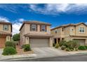 Charming two-story home with tile roof, attached garage, and well-maintained landscaping in a desirable neighborhood at 900 Harbor Ave, Henderson, NV 89002