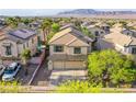 Beautiful aerial view of a two story home with desert landscaping and mountain views at 9052 Pine Mission Ave, Las Vegas, NV 89143