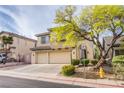 Two-story home with a three-car garage, front yard landscaping, and a welcoming entrance at 9052 Pine Mission Ave, Las Vegas, NV 89143
