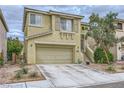 Charming two-story home with a two-car garage and well-maintained landscaping, offering curb appeal at 10798 Muscari Way, Las Vegas, NV 89141
