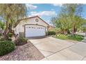 Exterior view showcasing well-manicured front lawn and mature landscaping at 3029 Paseo Hills Way, Henderson, NV 89052