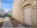 Close up exterior of unit 101 with sidewalk and front door at 4675 Color Up Ct # 101, Las Vegas, NV 89122