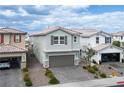 Charming two-story home featuring a two-car garage, well-kept landscaping, and a welcoming facade at 4698 Lucky Jade Ave, Las Vegas, NV 89141