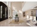 Grand foyer with marble floors, high ceilings, and elegant decor at 5020 Spanish Heights Dr, Las Vegas, NV 89148