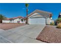 Charming single-story home features a concrete driveway and low-maintenance desert landscaping at 520 Stonehurst Dr, North Las Vegas, NV 89031