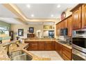 Well-equipped kitchen with granite countertops, stainless steel appliances, and ample cabinet space at 5940 Vizzi Ct, Las Vegas, NV 89131