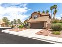 Charming two-story home featuring a well-manicured yard, tile roof, and spacious two-car garage at 94 Fantasia Ln, Henderson, NV 89074