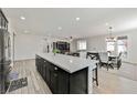 Modern kitchen with a large island, stainless steel appliances, and an open floor plan at 10126 Cliff Dwellings Ave, Las Vegas, NV 89178