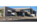 Modern home with xeriscaping and unique architectural features at 12 Chisel Crest Ct, Henderson, NV 89012
