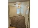 Bright bedroom featuring neutral carpet, a ceiling fan, and a window at 4176 Skywalker Ave, Las Vegas, NV 89120