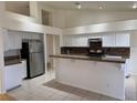 Open kitchen featuring white cabinets, stainless steel appliances, and granite countertops at 4176 Skywalker Ave, Las Vegas, NV 89120