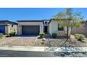 Charming single-Gathering home with brick paver driveway and desert landscaping at 8550 Lost Pony St, Las Vegas, NV 89148