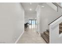 Inviting foyer with tiled flooring and staircase leading to the upper level at 11228 Burning River St, Las Vegas, NV 89183