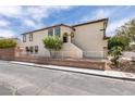 Side exterior of home featuring a small fenced yard and stucco siding at 11668 Tierney Creek Dr, Las Vegas, NV 89183