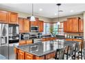 Beautiful kitchen featuring granite countertops, stainless steel appliances, and pendant lighting at 41 Stablewood Ct, North Las Vegas, NV 89084