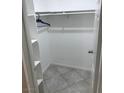 Walk-in closet featuring shelving and tile flooring at 461 N Lamb Blvd # H, Las Vegas, NV 89110