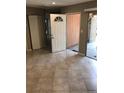 Open entryway showcasing neutral tile flooring and a view of the front door at 461 N Lamb Blvd # H, Las Vegas, NV 89110