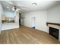 Bright living area with wood flooring, fireplace and easy kitchen access at 855 N Stephanie St # 112, Henderson, NV 89014