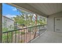 Balcony with a view of the landscaped community grounds and mature trees at 2819 Bluebonnet Dr # 6, Henderson, NV 89074