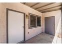 Covered entrance to unit, showcasing security gate and exterior lighting fixture at 3508 Rio Robles Dr # A, North Las Vegas, NV 89030