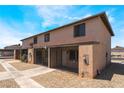Full exterior view of townhome showcasing two-story design and gated front porch at 3508 Rio Robles Dr # A, North Las Vegas, NV 89030