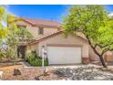 Charming home featuring desert landscaping, a tile roof, and an attached garage at 3728 Ashling St, Las Vegas, NV 89129
