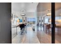 Modern kitchen with stainless steel appliances and stylish breakfast bar overlooking the bedroom at 4381 W Flamingo Rd # 1109, Las Vegas, NV 89103