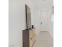 Bright hallway featuring tile flooring, recessed lighting and a stylish cabinet for storage or display at 5692 Tinar St, Las Vegas, NV 89113