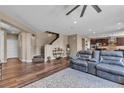 Spacious living room features hardwood floors, stairs, and plenty of natural light at 10412 Deer Heights St, Las Vegas, NV 89178