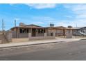 A charming single-story home featuring a covered porch and secure fenced yard at 1189 Blankenship Ave, Las Vegas, NV 89106