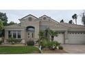 Charming single-story home with a well-manicured front yard and a three-car garage at 1350 Rossini St, Henderson, NV 89052