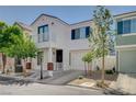 Attractive two-story home boasts a balcony, attached garage, and well-maintained landscaping, exuding curb appeal and inviting charm at 1531 Evening Spirit Ave, Las Vegas, NV 89183